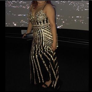 Black A-line gown with gold beading